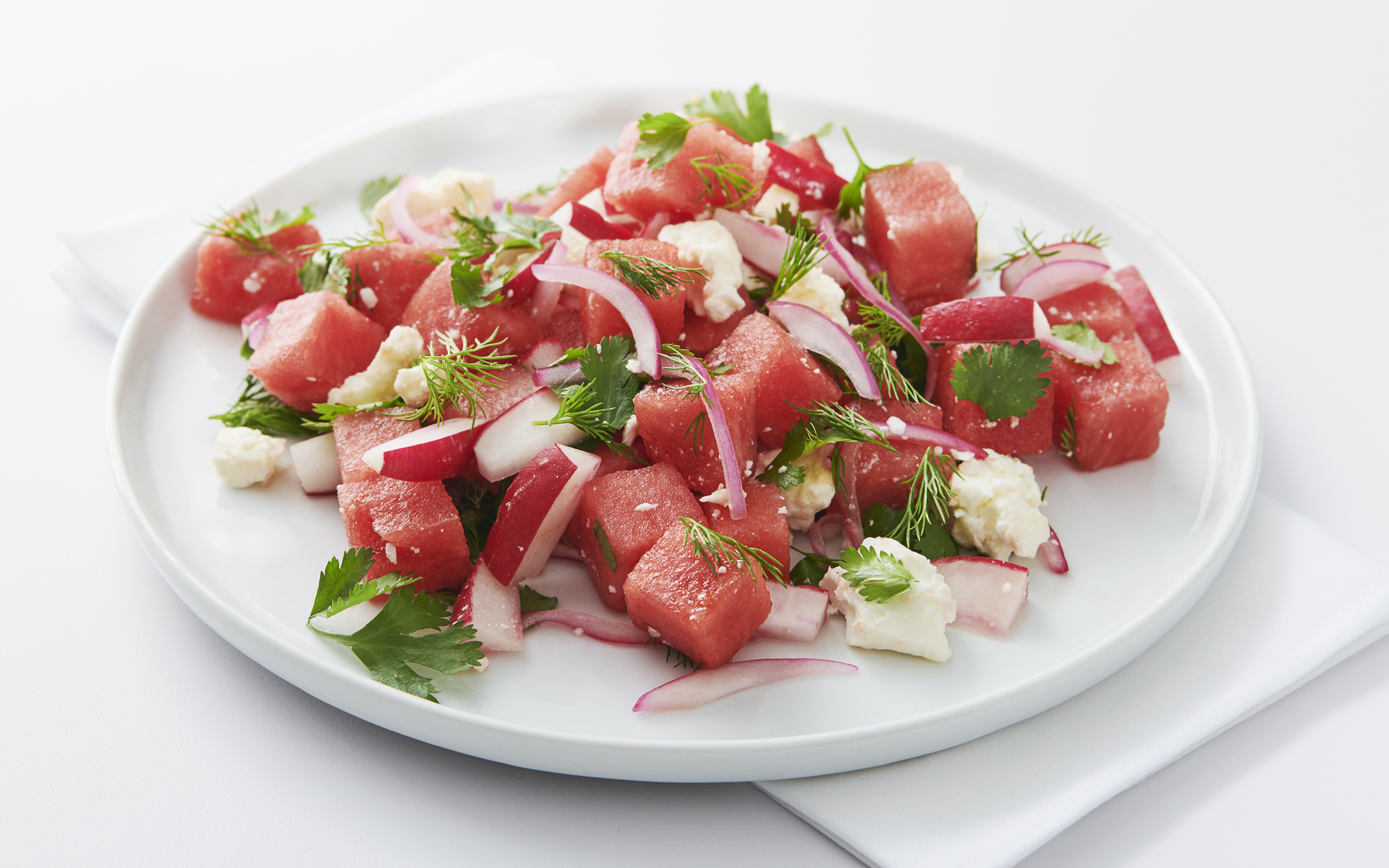 Bowl of watermelon salad with feta